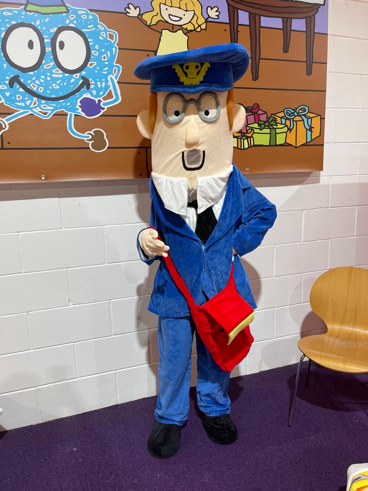 Postman character mascot costume available for hire at Buddies Play Den in Clay Cross near Chesterfield.